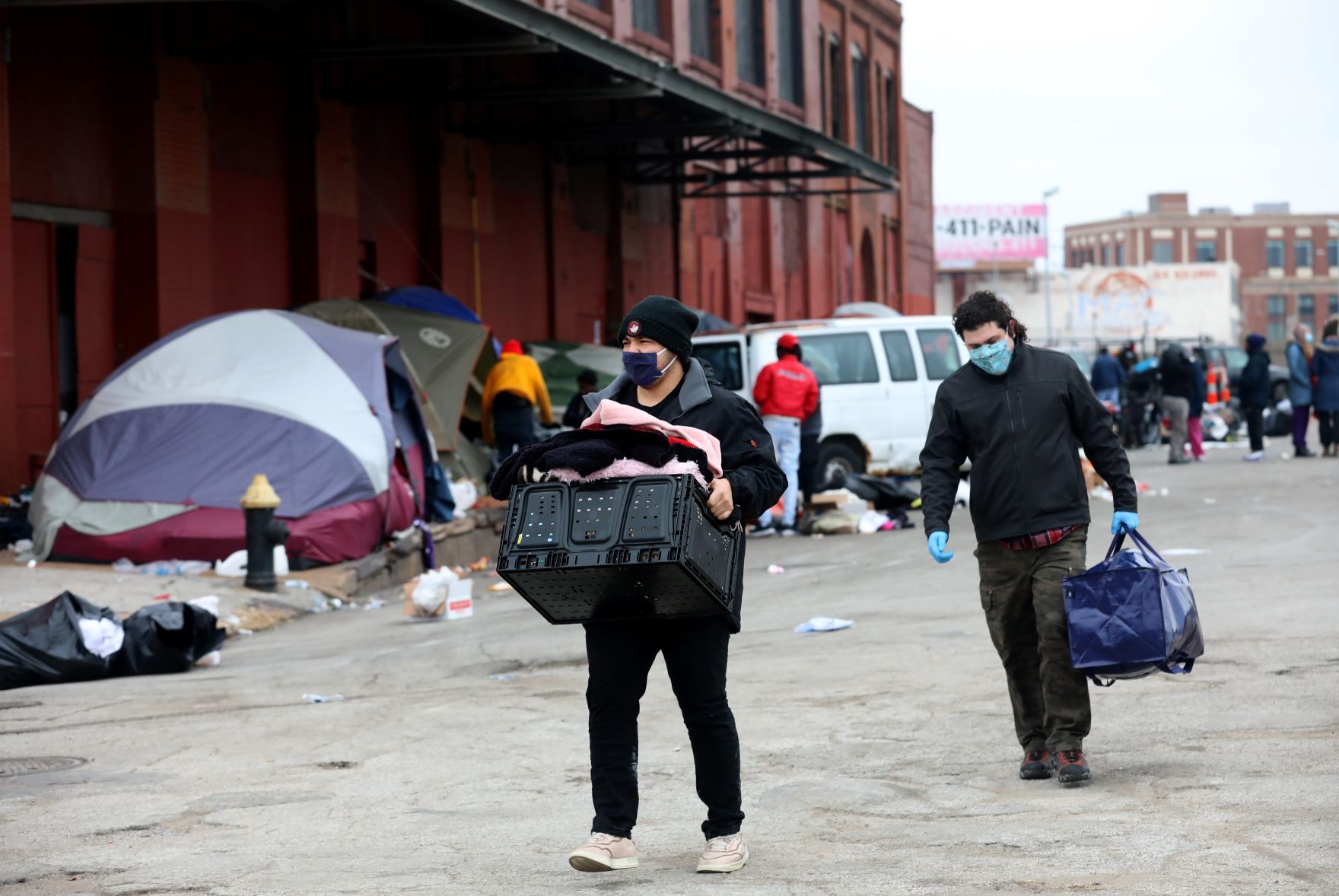 Tent encampment outside vacant McGuire Moving & Storage building